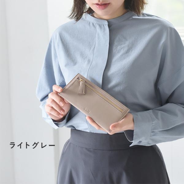 新品☆NY土産☆タッセル付き　スリムウォレット　 本革ラムレザー タッセル付 お札を折らずに収納できる 薄型長財布